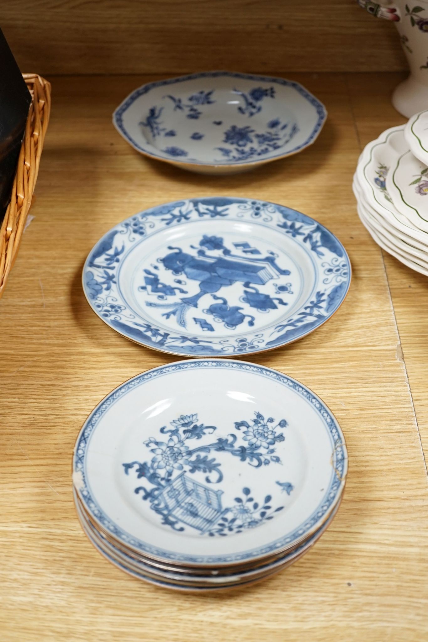A Set of six 18th century Chinese export blue and white ‘bird in a cage’ small plates, 6.3 cm diameter and two pairs of 18th century Chinese export blue and white plates dishes, largest 23cm diam (10)